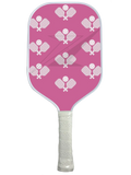 Pink pickleball paddle with a fun design featuring repeated paddle graphics.